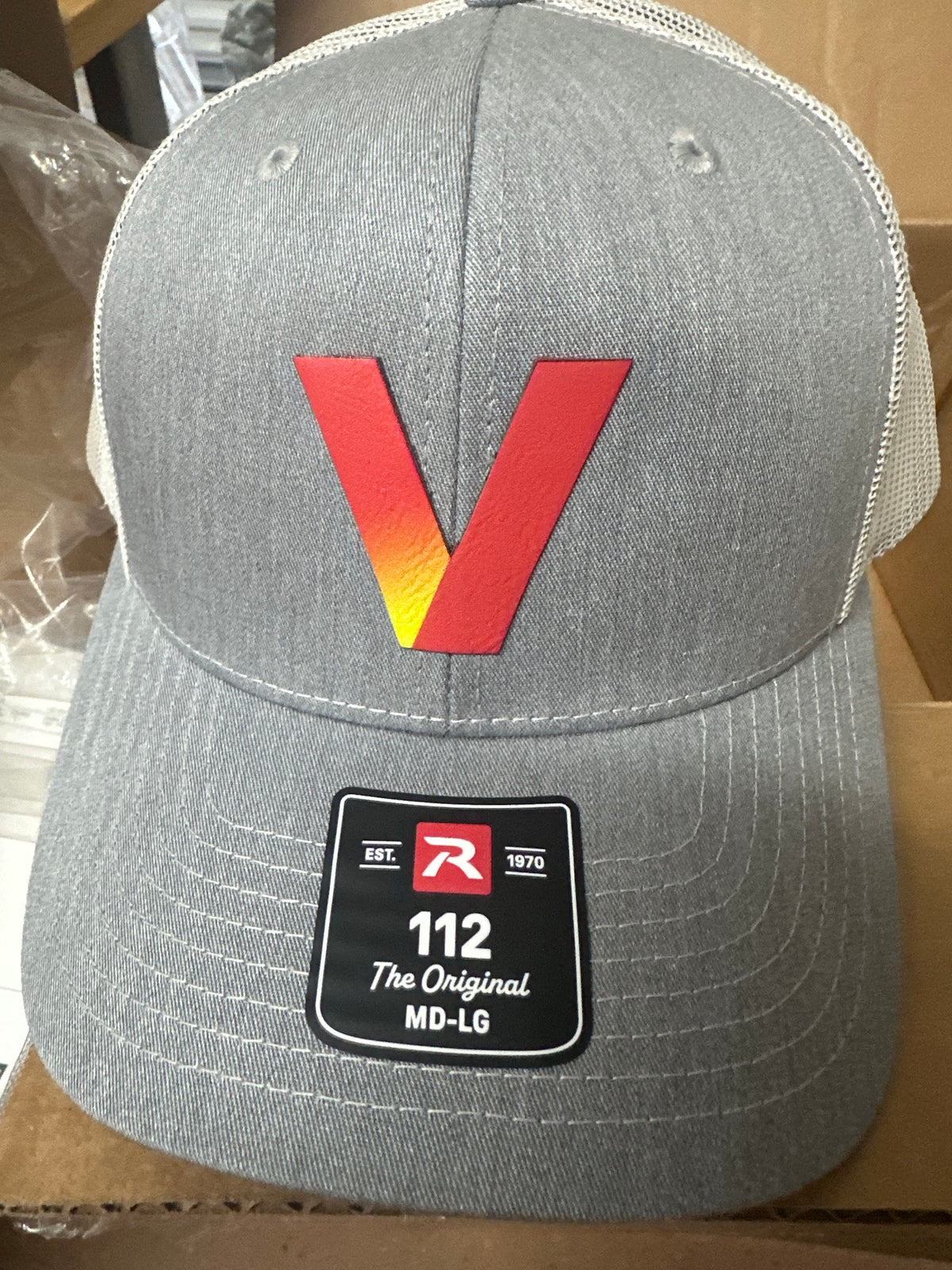 Heather grey Richardson 112 hat with a custom logo leather patch